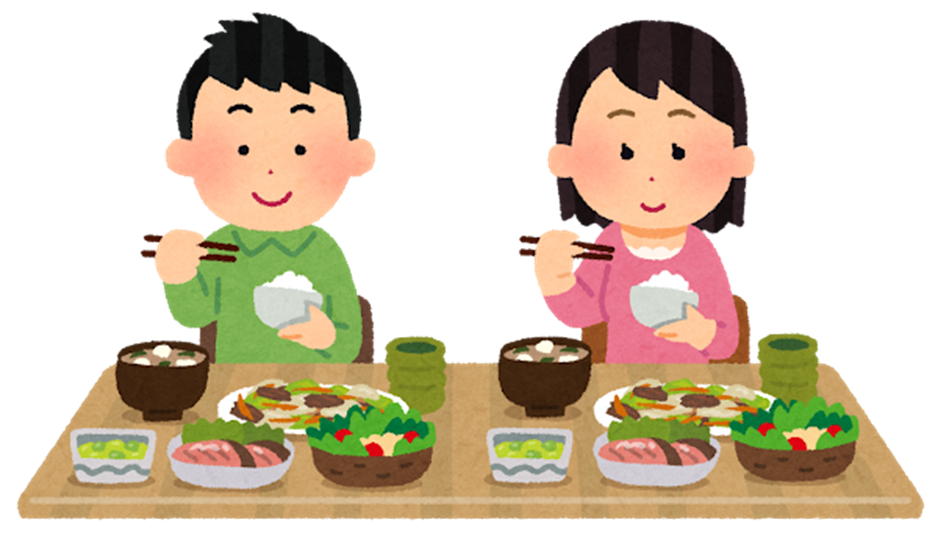 食事をしている男女の画像